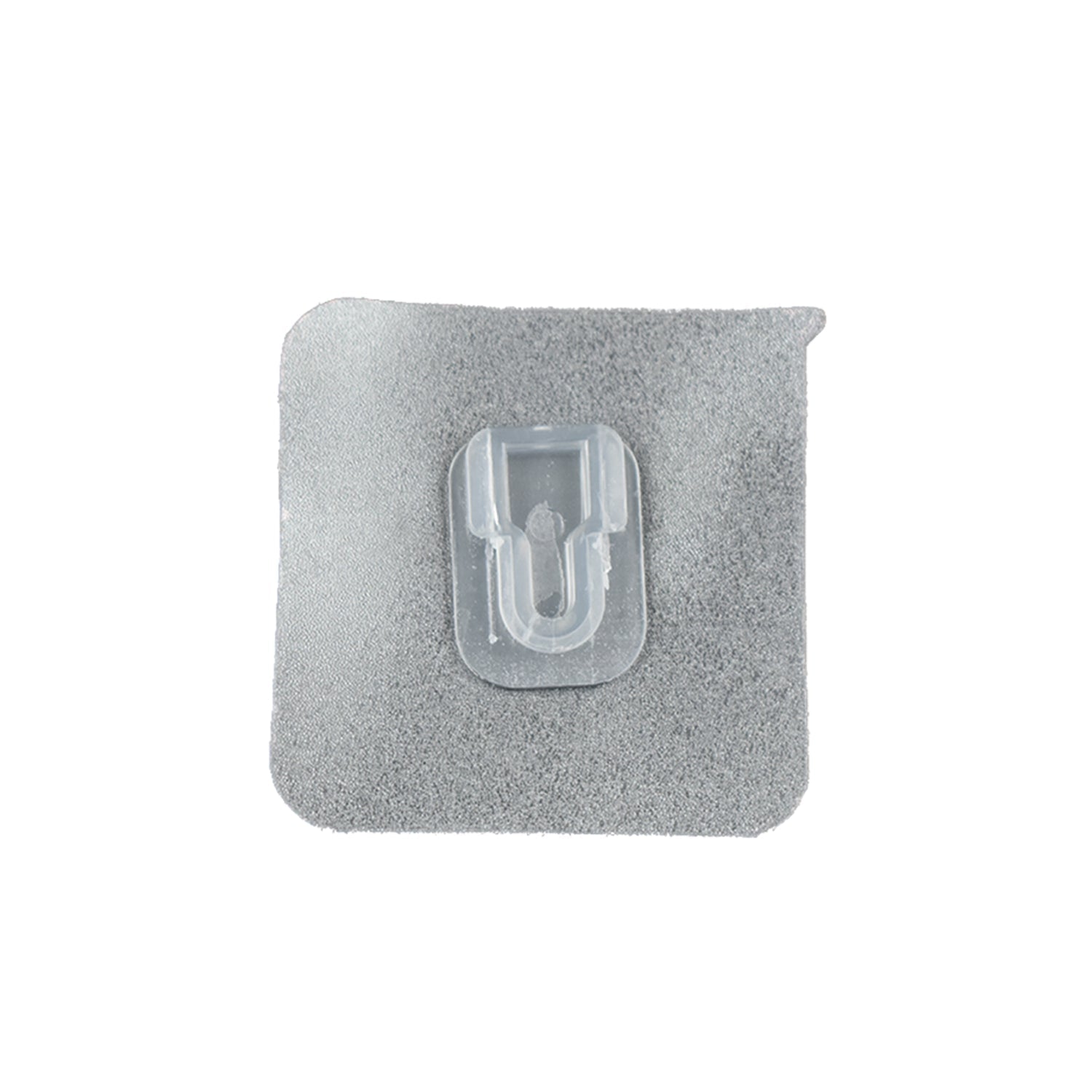 GlimmerHome transparent adhesive hook discreetly blending into a white wall.