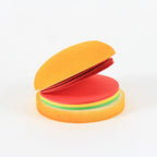 Top-down view of the multicolor burger memo pads, highlighting their compact and appealing form.