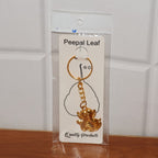 Golden Ganesh keychain with sturdy chain and keyring attached