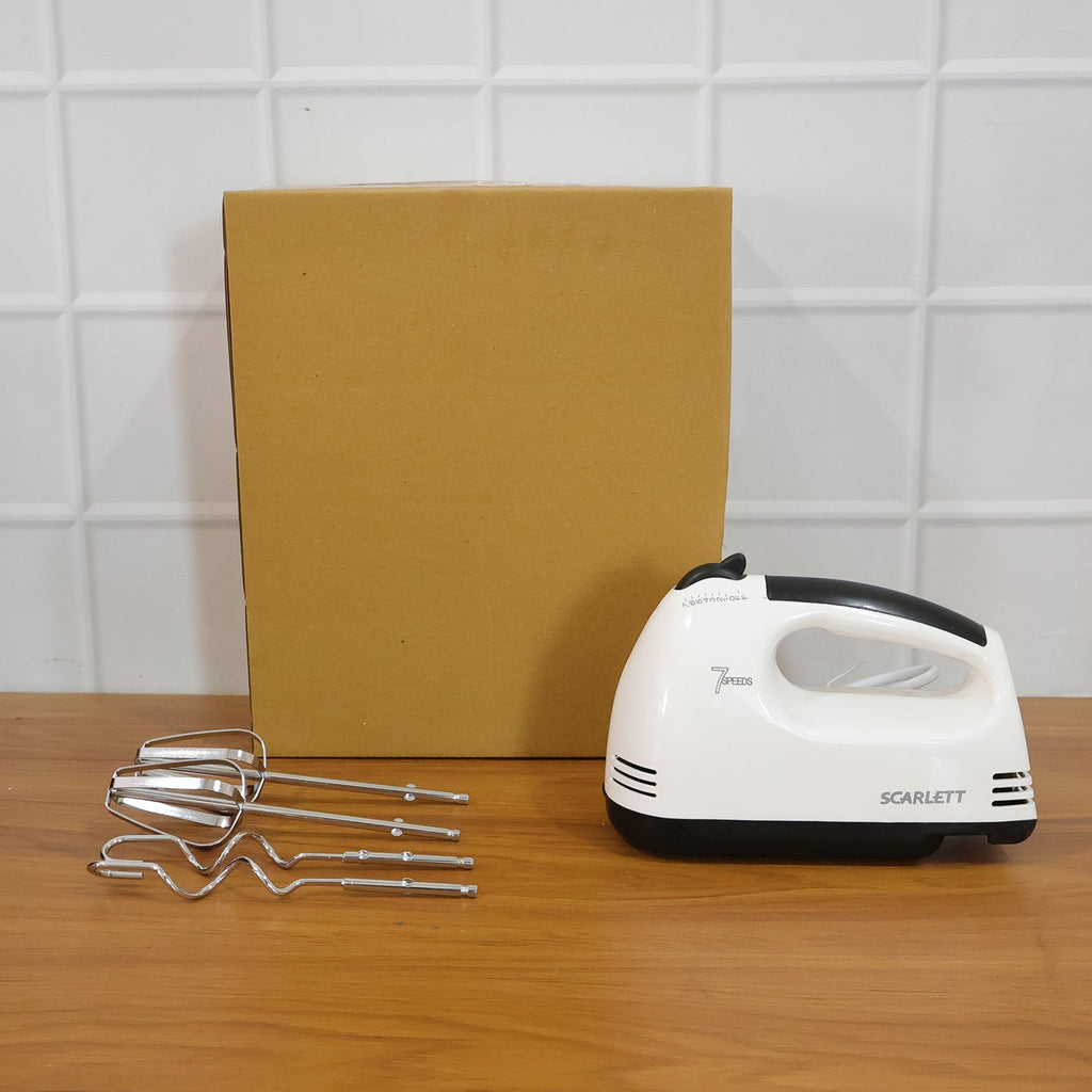 Electric hand mixer and accessories ready for kitchen baking tasks