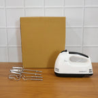 Electric hand mixer and accessories ready for kitchen baking tasks