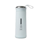 Durable glass water bottle with a protective grey silicone sleeve and bamboo lid for a firm grip.