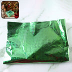Metallic gift wrap sheets styled with ribbon and gift box decoration