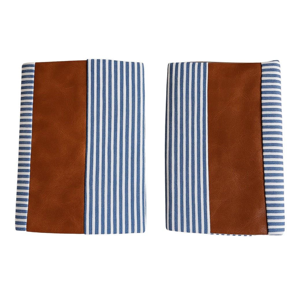 Pair of leather and cotton pillow covers on a modern sofa