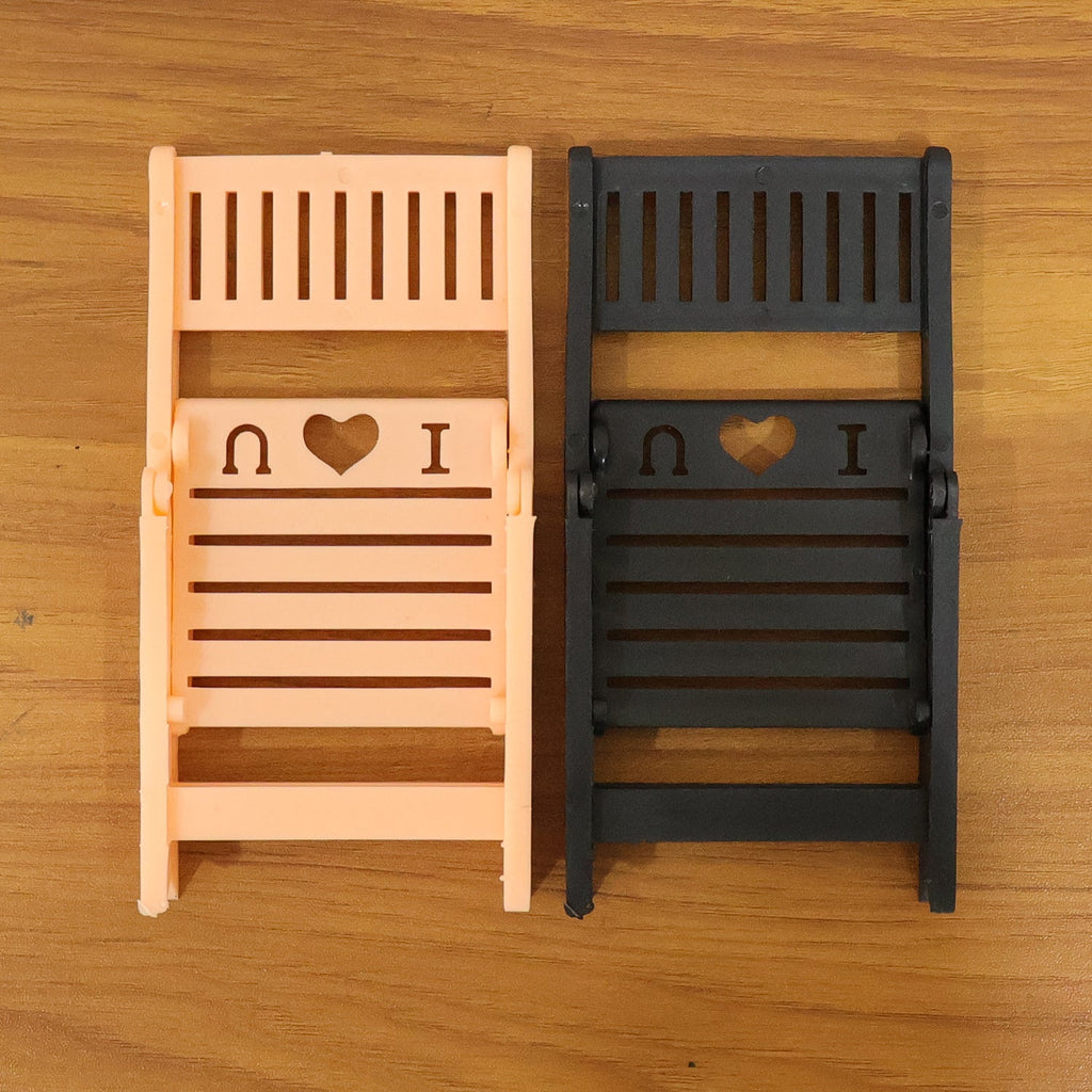Foldable mini chair mobile phone stand displayed on white background