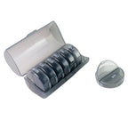 The seven individual rainbow-colored daily pill boxes neatly arranged outside the main organizer.