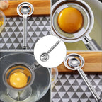 Close-up of the stainless steel egg white separator, showcasing its design.