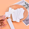A pack of 36 clear double-sided body tape sheets for lingerie, showing discreet application.