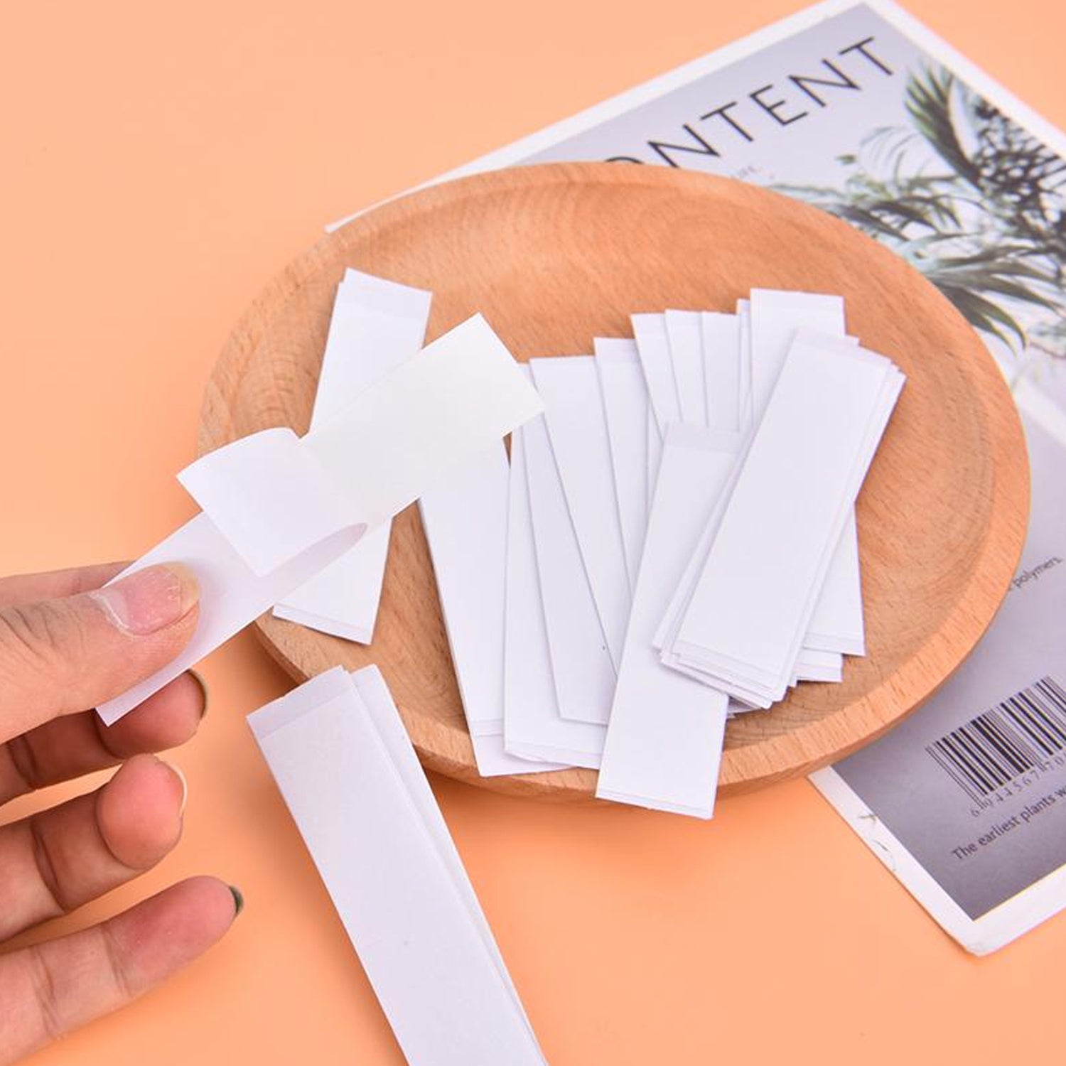 A pack of 36 clear double-sided body tape sheets for lingerie, showing discreet application.