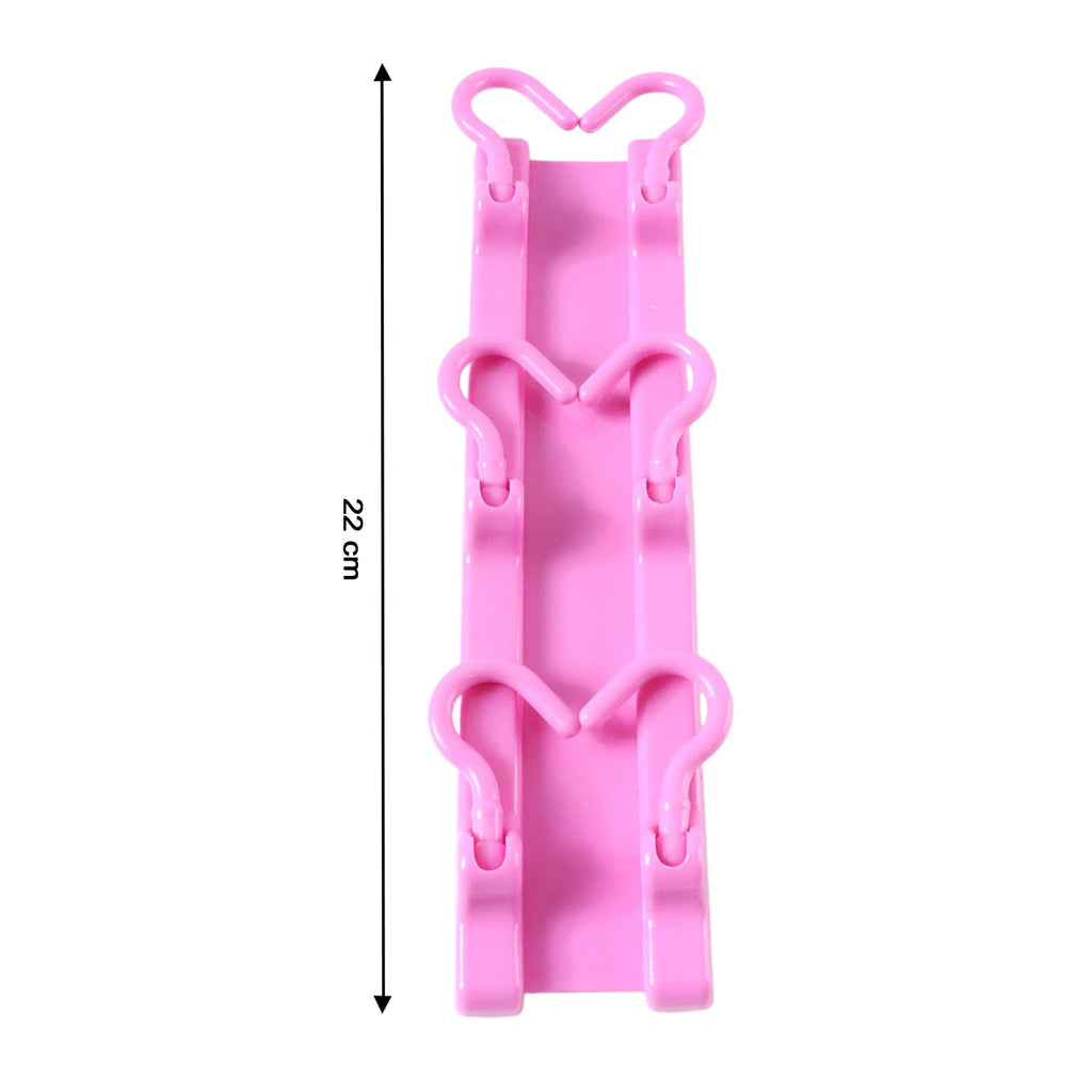 Foldable wall hook hanger in pink color for versatile use
