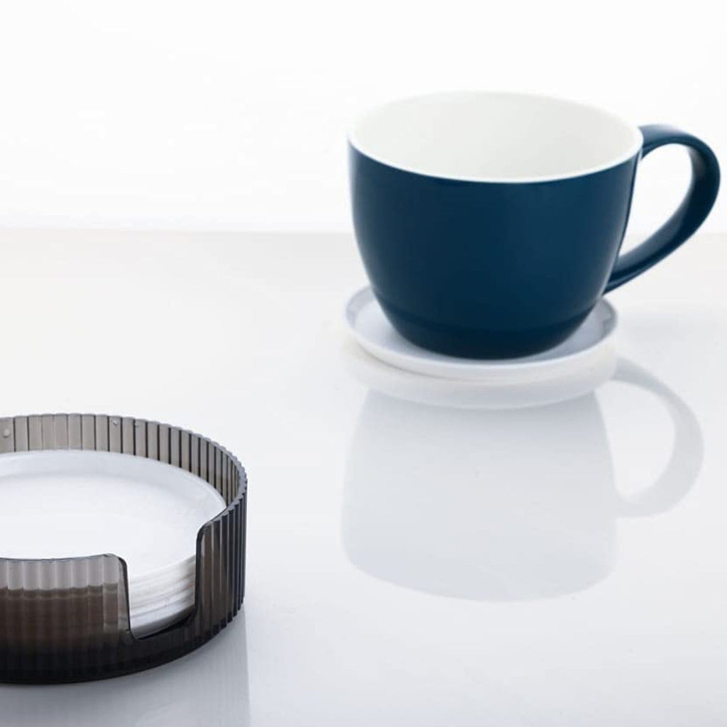 Versatile plastic coasters in multiple designs, enhancing home decor while protecting tables.