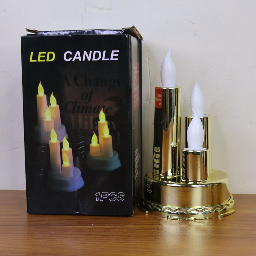 Decorative electronic candle lamp with three LED flames in golden finish