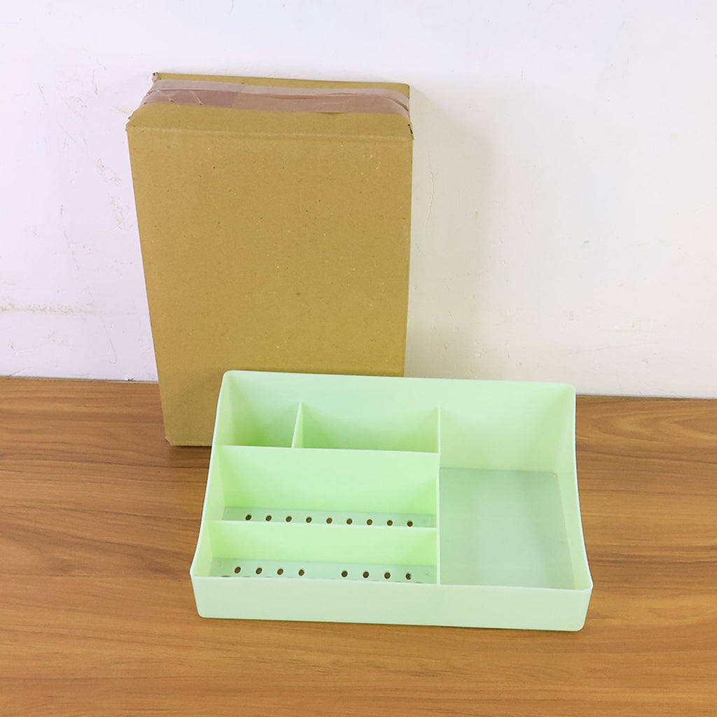 Organized desk featuring multi-section storage tray as a desk organizer