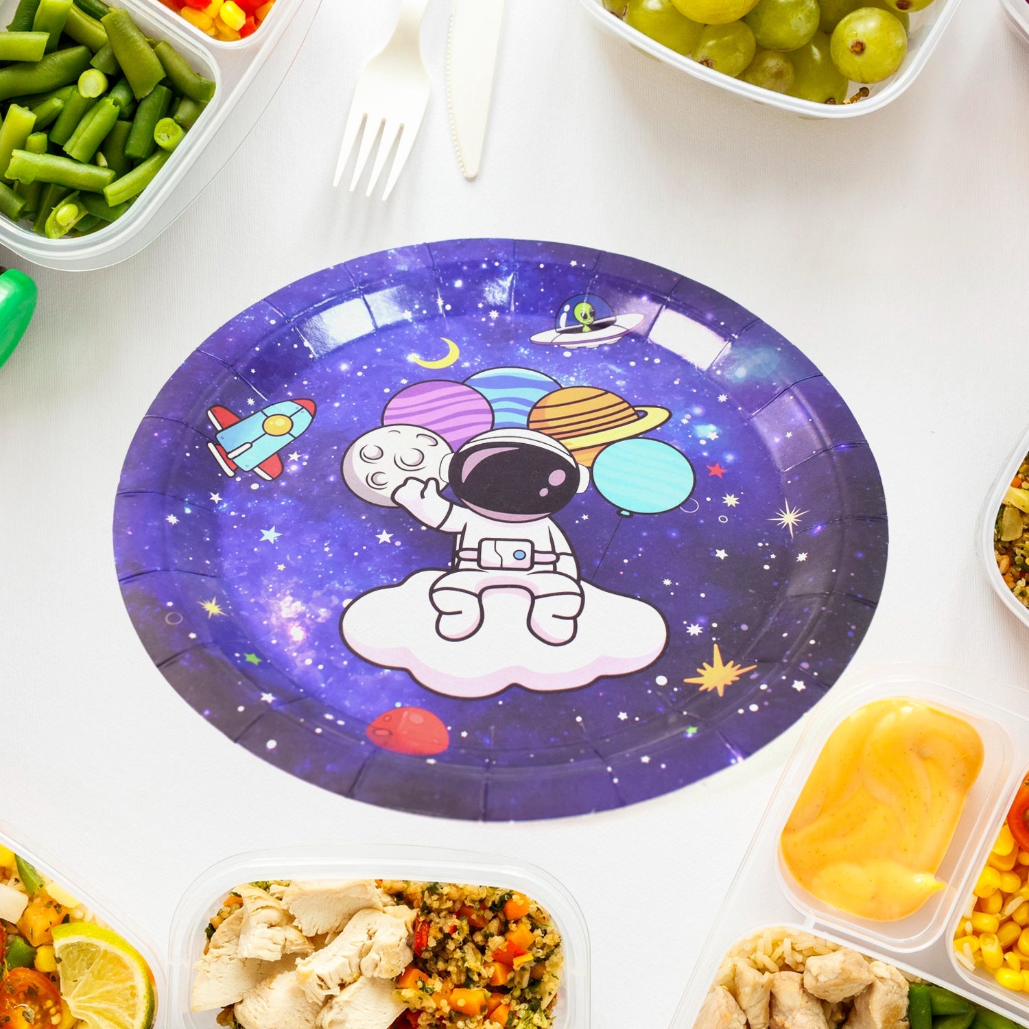 Brightly colored disposable paper plates with 'Festive Fun' motifs for parties.