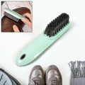 Ergonomic Shoe & Clothes Cleaning Brush with soft bristles, ready for use.