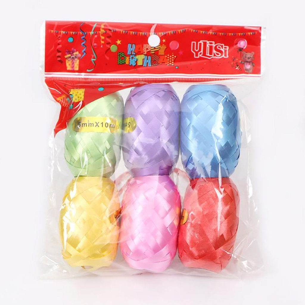 Assorted plastic curling ribbon rolls, ready for creative craft projects.