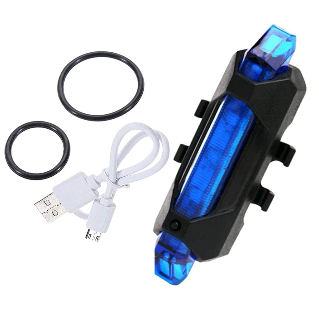 Hand holding the blue rechargeable LED bicycle light, showing its portability and ergonomic design.