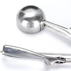 Ice cream scoop placed on a kitchen counter, ready to serve.