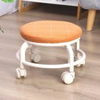 Low height rolling stool in white, designed for easy movement across floors.