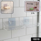 Close-up view of clear transparent soap dish holder mounted on bathroom wall