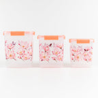 Stackable floral food storage container set with transparent bodies.