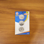 A practical stainless steel hook holding a kitchen towel, enhancing kitchen organization.