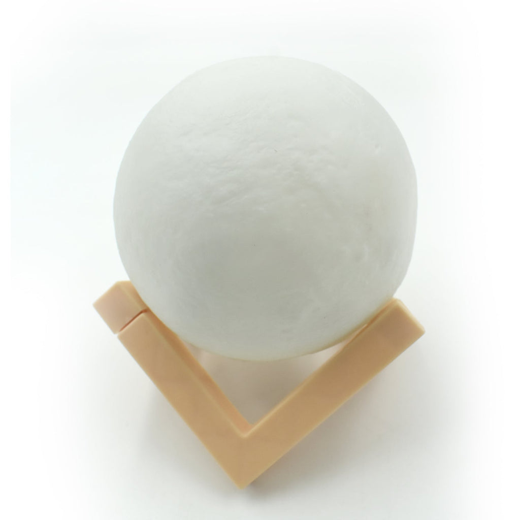 Close-up of the 3D moon lamp showcasing its detailed surface and touch sensor.