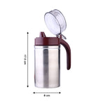 Compact stainless steel oil dispenser, perfect for any kitchen countertop.
