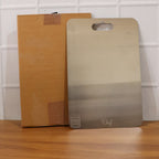 Versatile stainless steel cutting board for meat and vegetables