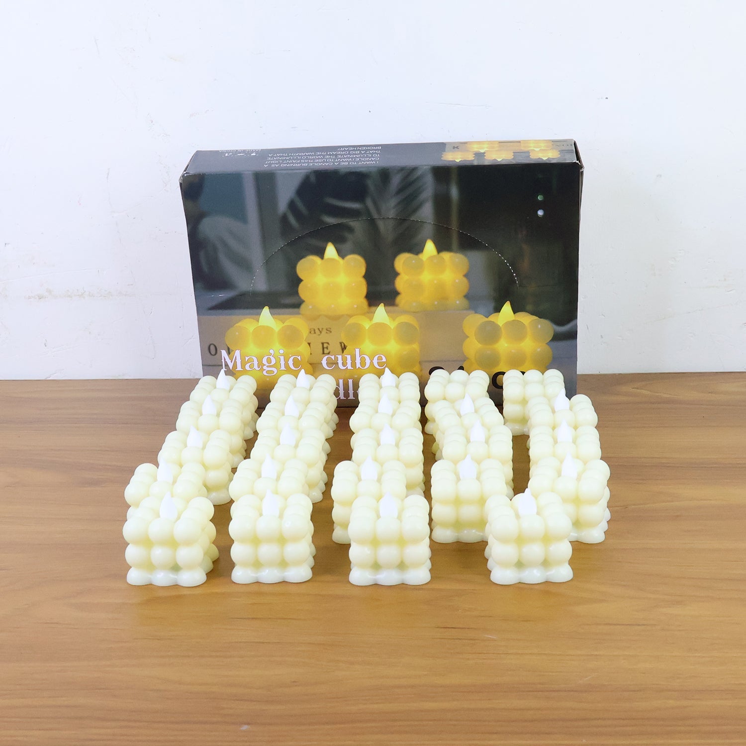 Ambient lighting created by glowing LED flameless cube decorative candles