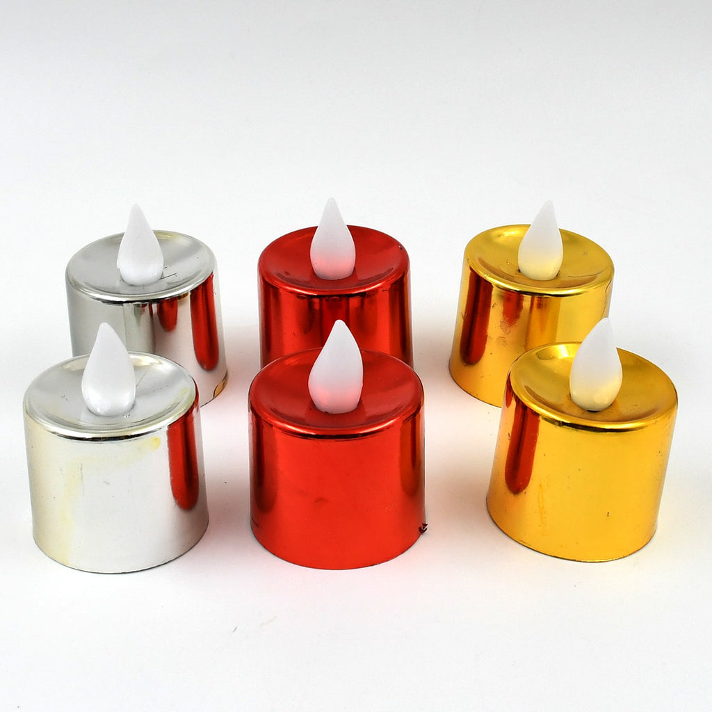 Decorative LED tea light candle glowing softly on a surface.