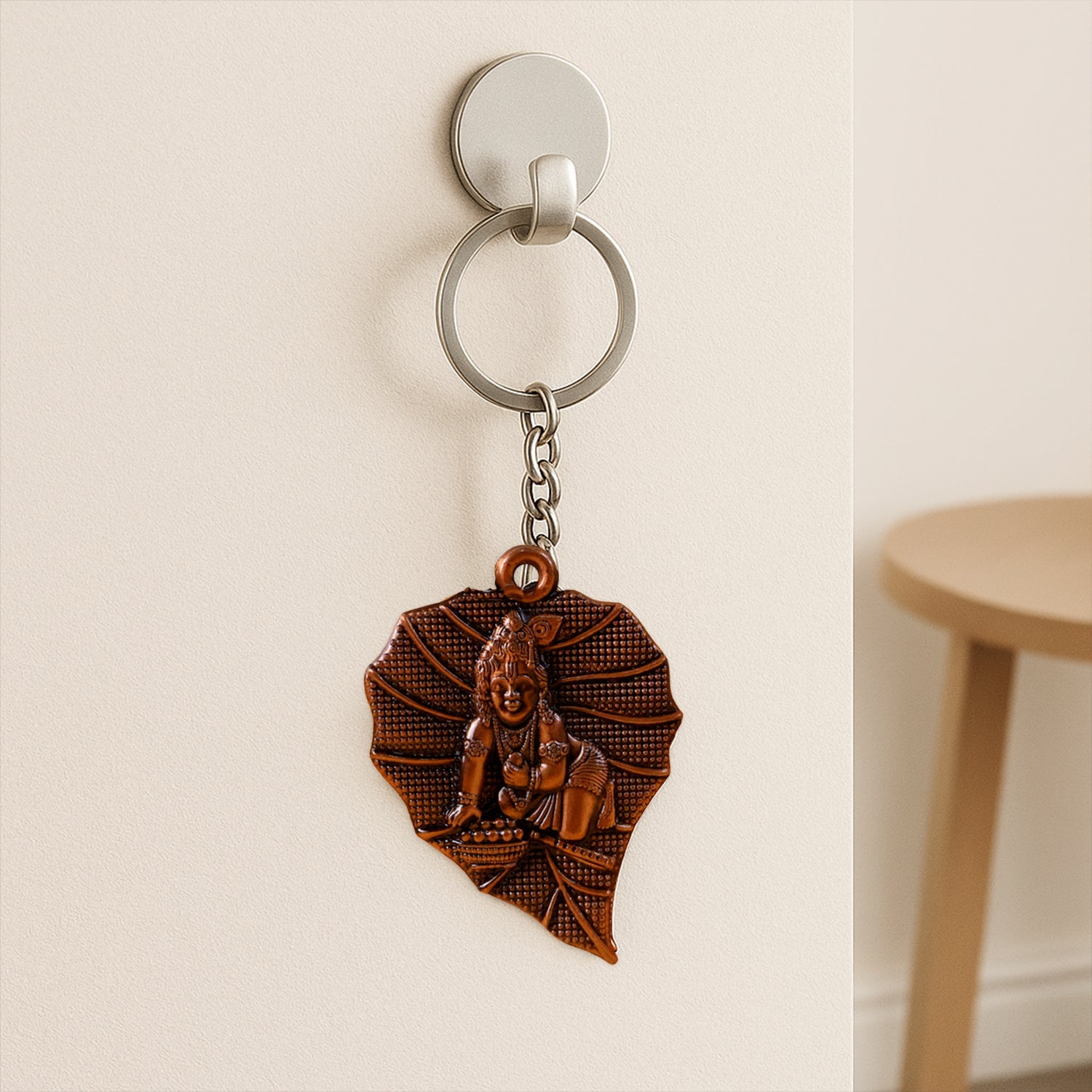 Bal Krishna motif highlighted on antique bronze metal keychain