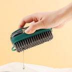 Hand-held hydraulic cleaning brush with soft grip