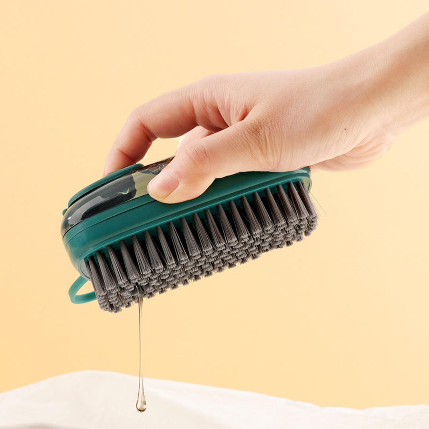 Hand-held hydraulic cleaning brush with soft grip