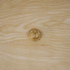 Golden kankavati with lid in traditional pooja setting