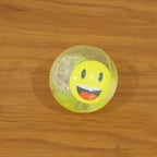 Kids using smiley face sensory water ball toy in play