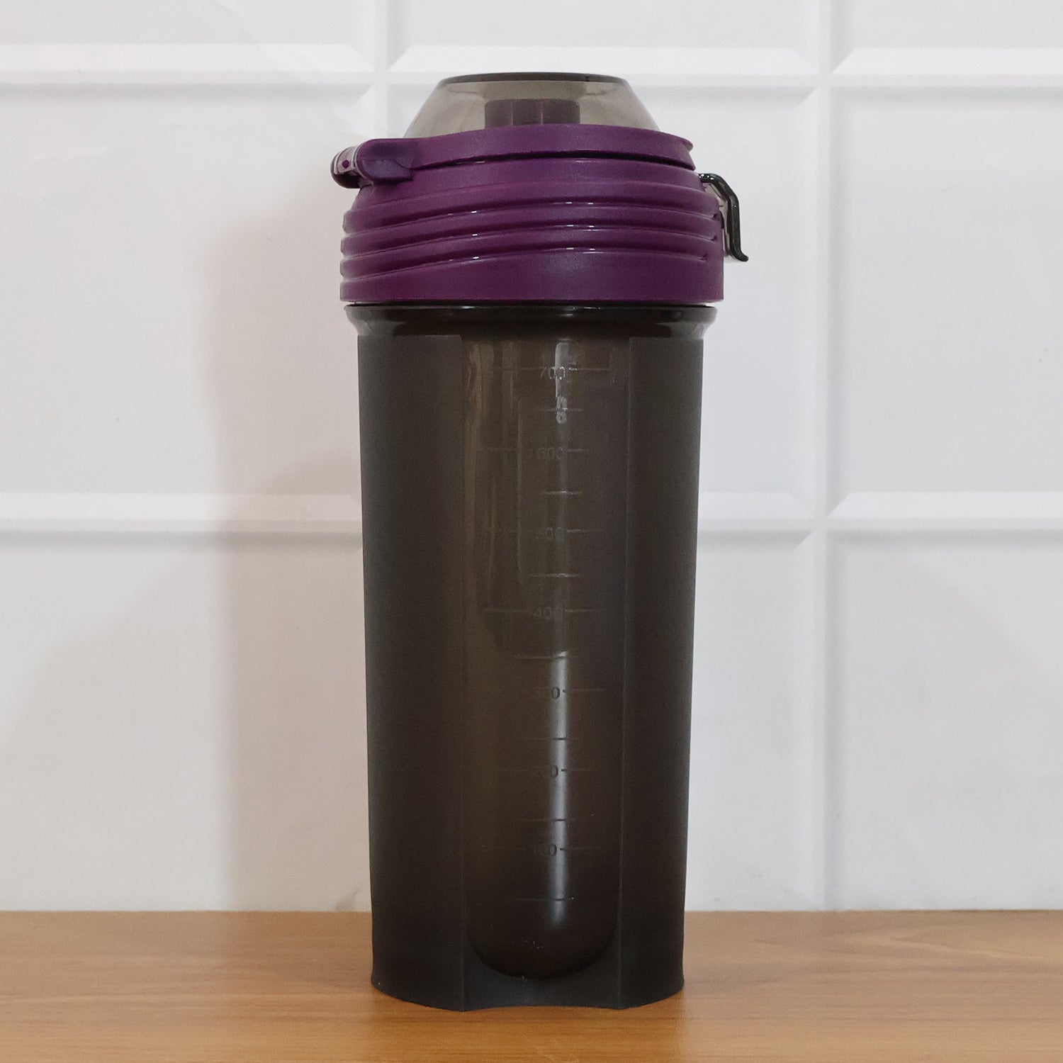 Portable protein shaker bottle ideal for gym and outdoor activities