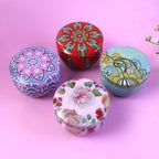 Close up of multicolor mandala artwork on metal candle container