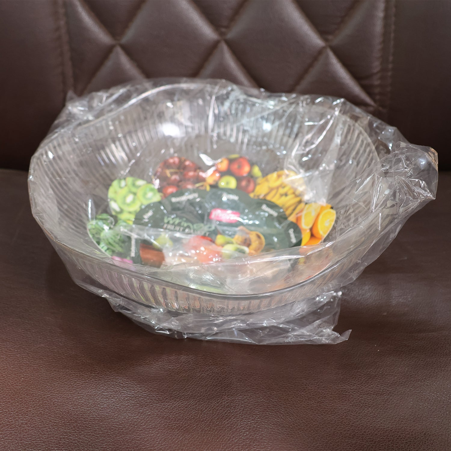 Plastic fruit basket placed in kitchen setting