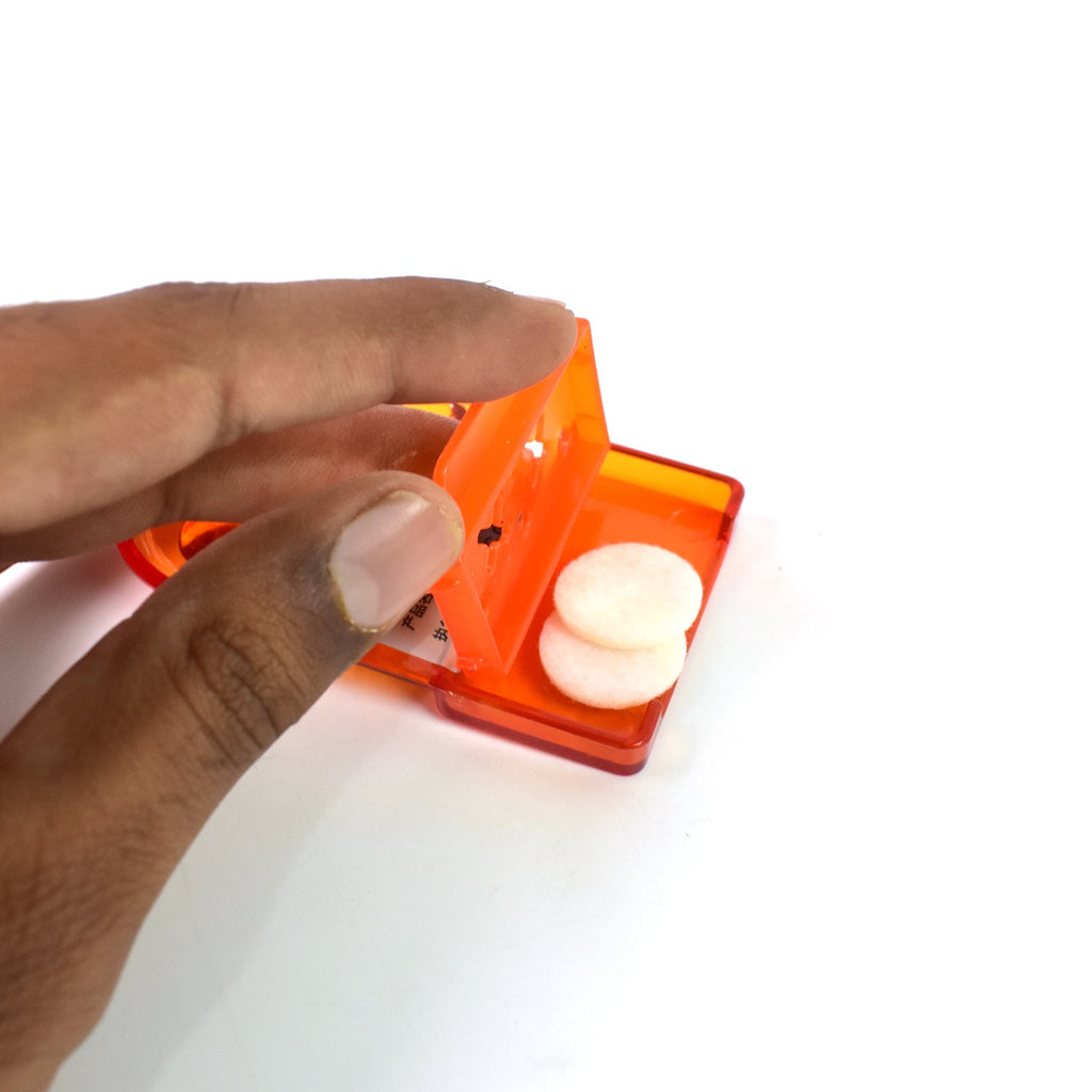 Person using the hygienic toilet lid lifter to avoid direct contact with the seat.