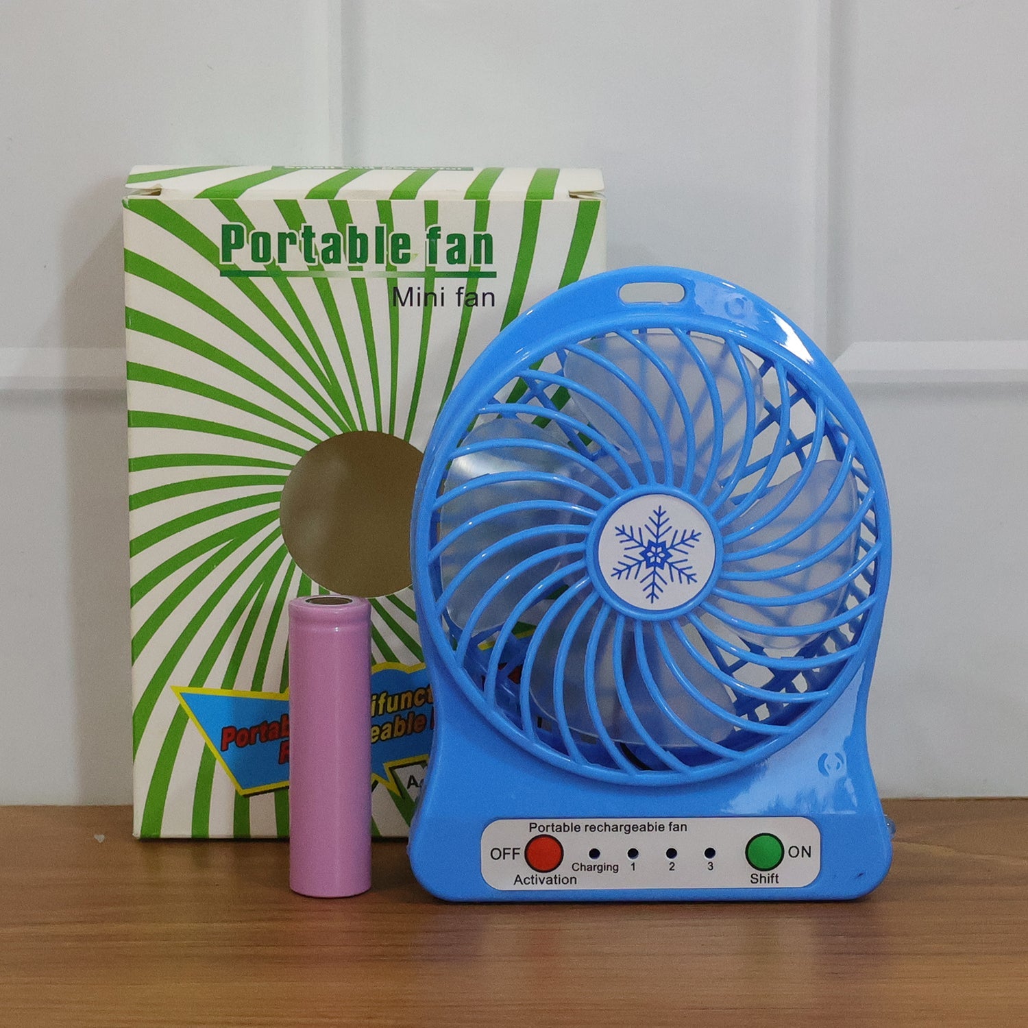 Mini table fan operating quietly on desk providing refreshing airflow