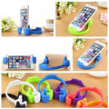 Hand-shaped mobile stand in white, showcasing its unique design.