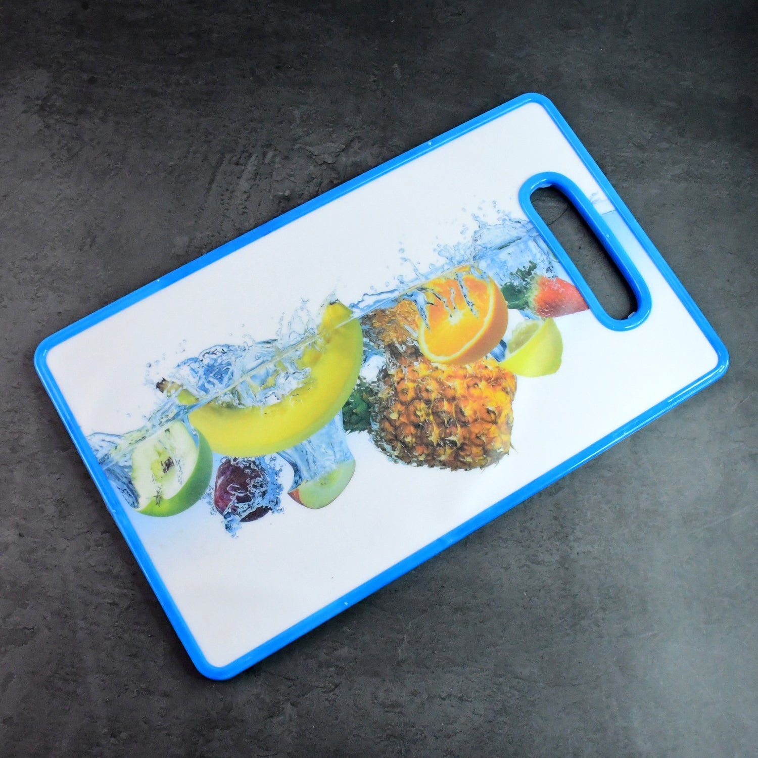 Fruit print kitchen chopping board with easy grip handle