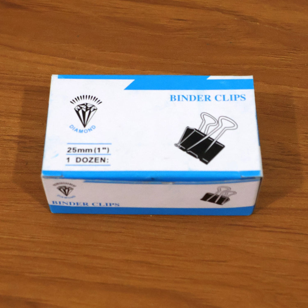 Multiple heavy duty black metal binder clips arranged for office use