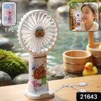 Rechargeable handheld fan featuring cartoon capybara design used as a hand fan