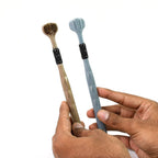 Angled view of the 3-Sided Toothbrush, showing its soft bristles for gentle cleaning.