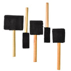 Five sponge paint brushes arranged showing wooden handles and foam tips