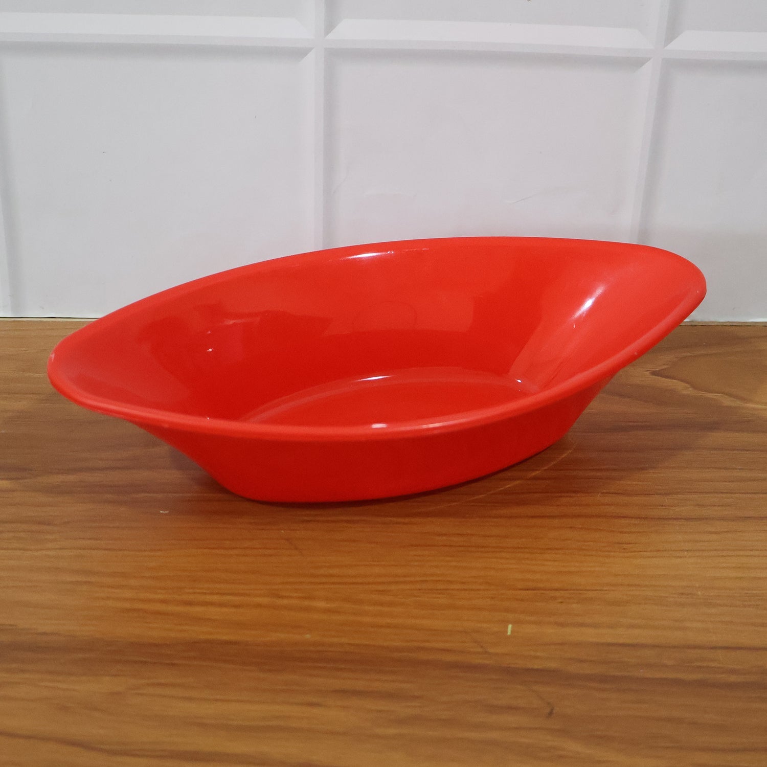 Multiple angled views of red plastic Marin serving bowl