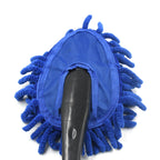 Microfiber car wash brush being used to clean a car's windshield, ensuring clear visibility.