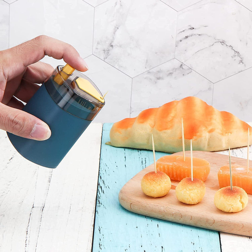 White automatic toothpick dispenser revealing its simple refill mechanism.